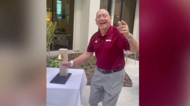 College basketball analyst Dick Vitale rings "cancer-free" bell