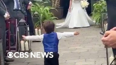 Toddler runs down aisle to mom