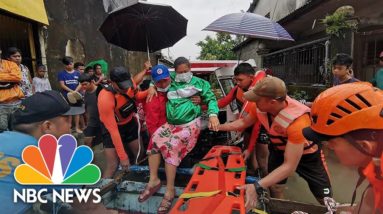 Watch: Rescuers Evacuate People From Floods In Philippines