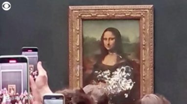 "Mona Lisa" attacked with cake in apparent climate protest