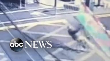 Cyclist crashes into barriers ahead of approaching train