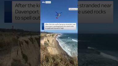 Kite surfer spells 'help' to get rescued