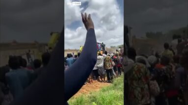 Crowds surround collapsed school