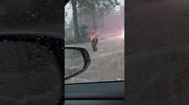 Terrifying moment driver gets trapped in SUV as street floods around him #flood #driving #rescue