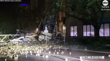 Construction crane smashes into building as Hurricane Milton lashes Florida