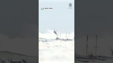 Boats toppled by large waves in Peru